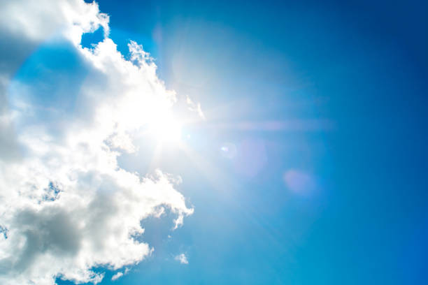 istock Shining sun at clear blue sky 1254869223