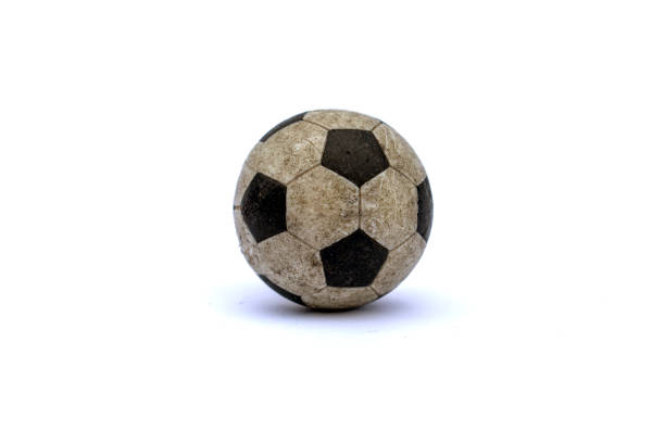 Scratched used dirty soccer ball toy / miniature on white studio background