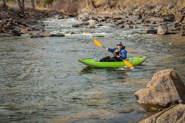 istock senior paddler in  inflatable whitewater kayak 1254870966