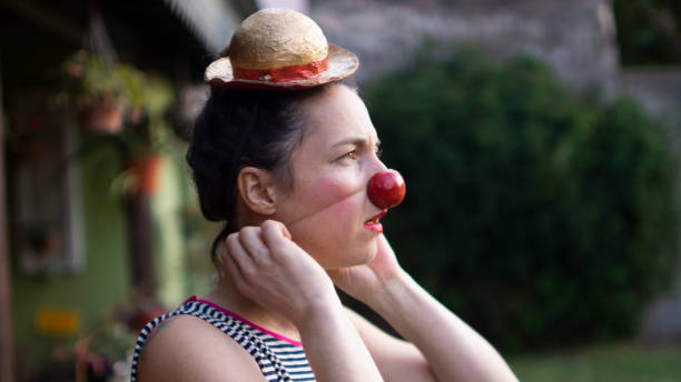 istock young woman with clown nose 1254875488