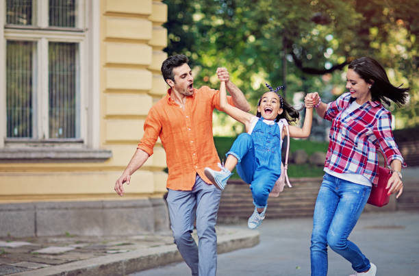 istock Happy family is walking in a park 1254878886