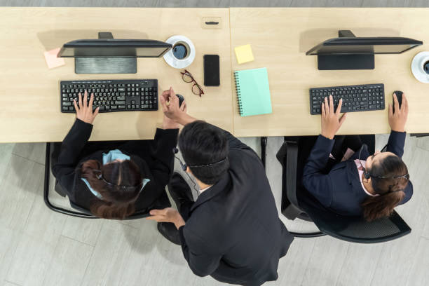 istock Business people wearing headset shot from top view 1254879760