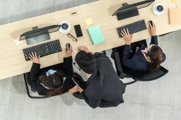 istock Business people wearing headset shot from top view 1254880015