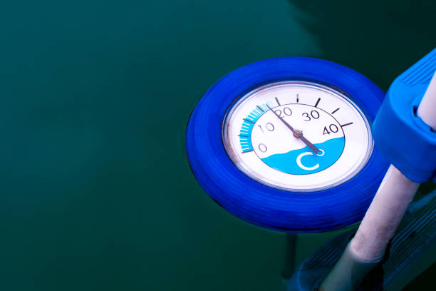 Blue thermometer for pool with a cold water. Close up