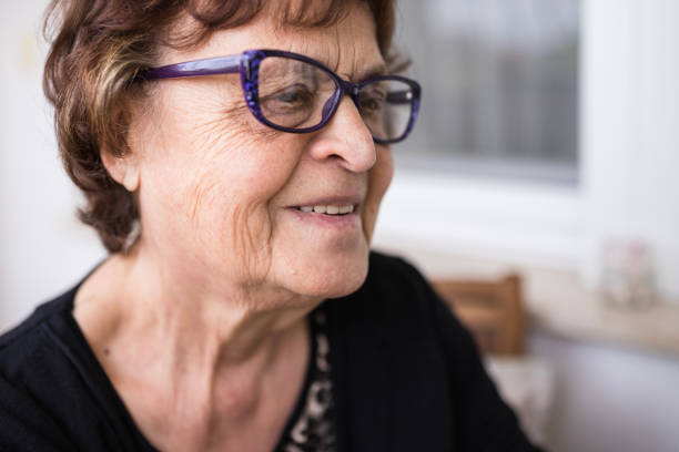 istock Lovely senior woman smiling 1254883200