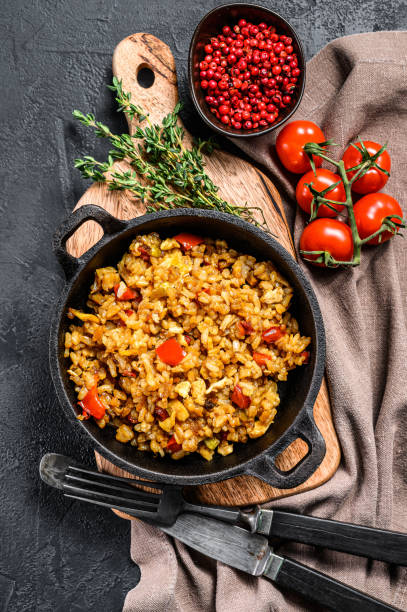 istock Fried Rice with Vegetables and eggs. Chinese Cuisine.  Black background. Top view 1254883379