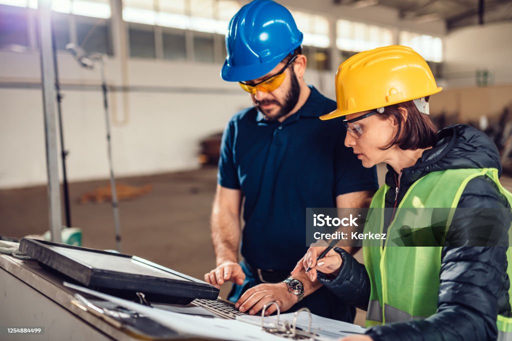 Cnc Machine Operator And Industrial Engineer Typing Fabrication Program ...