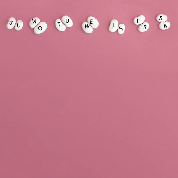 istock Days of the week on a pink background, letters on beans. The creative schedule for fun learning, business or Hobbies . Photo for blog, organizer, time management 1254886097