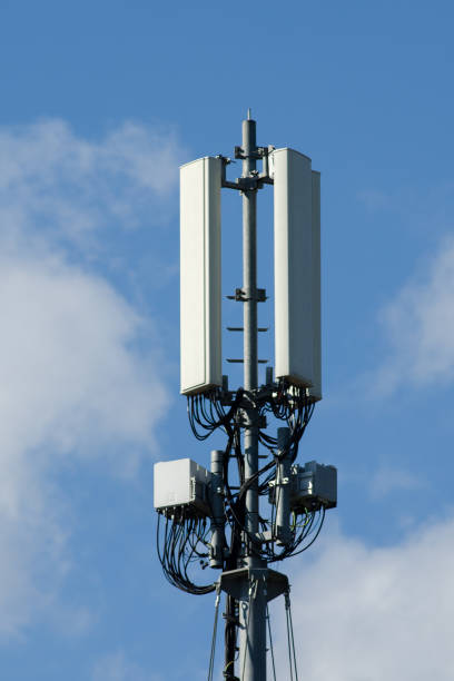 istock Telecommunication tower of 4G and 5G cellular. Cell Site Base Station. Wireless Communication Antenna Transmitter. Telecommunication tower with antennas against blue sky. 1254890564