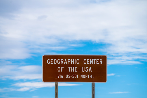 The tourist attraction - the Geographic center of the contiguous United States, near Lebanon, Kansas, USA. The road sign