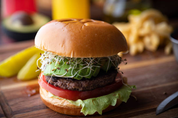 istock healty burger with sprouts and avocado slices 1254897741