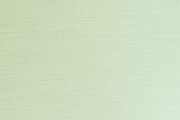 istock Cotton silk blended fabric wall paper texture pattern background in pastel white pale lime green cyan color tone 1254897917