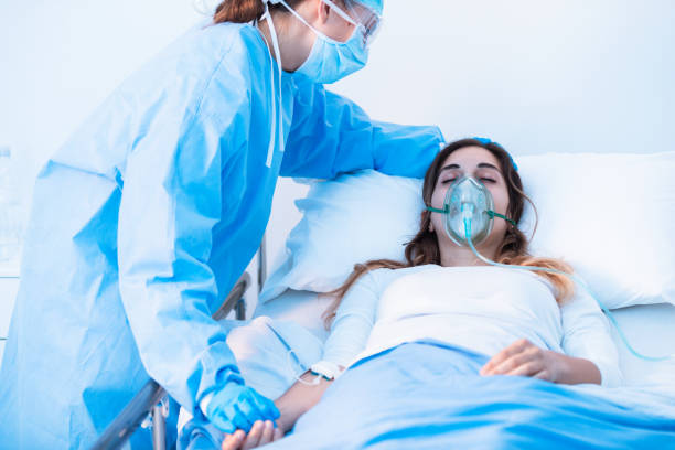istock Nurse comforting a sick patient in the ward 1254898273