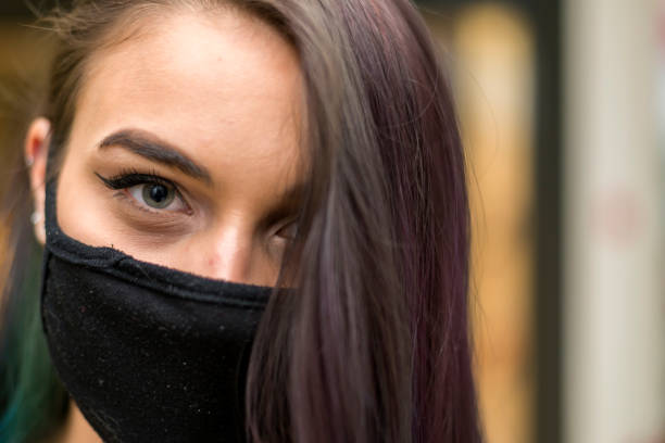 istock Woman with protective face mask - portrait. 1254899057
