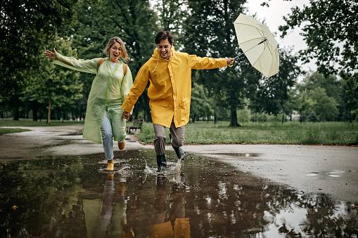 Couple walking in the rainy day