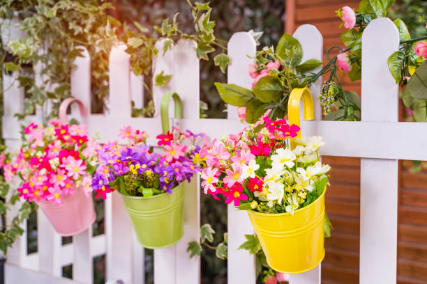 istock Hanging Flower Pots with fence 1254911220