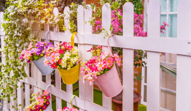 istock Hanging Flower Pots with fence 1254911304