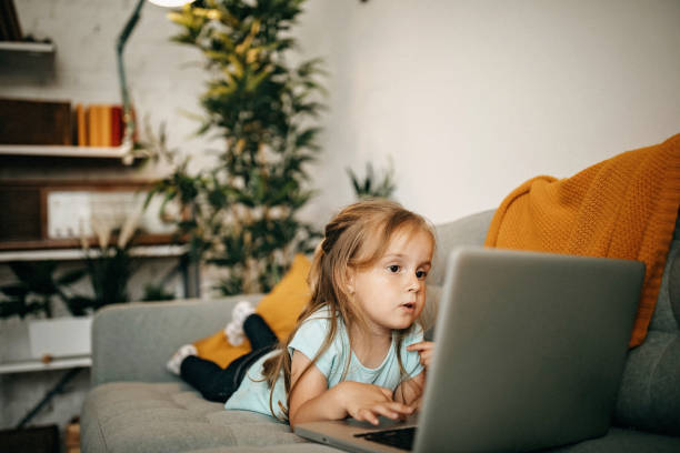 istock Kid using laptop to watch cartoon 1254911863