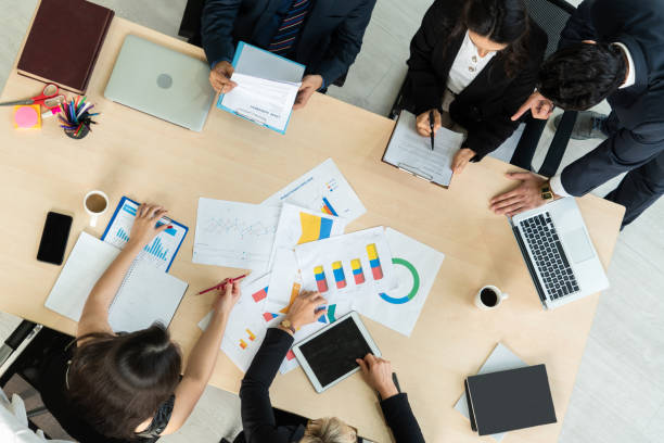 istock Business people group meeting shot from top view 1254912055