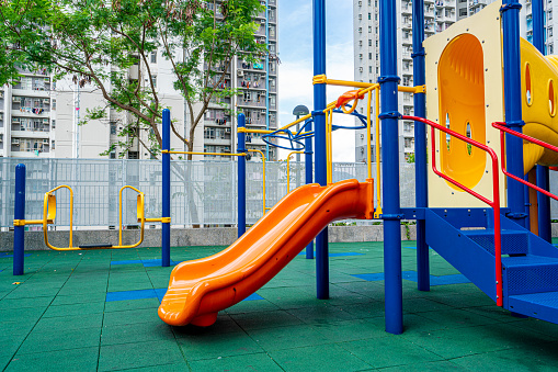 View of shot of children playground and park and housing background