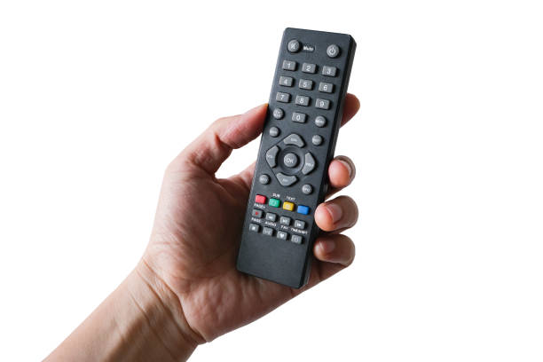 istock His hand is holding the remote control and operate the remote control. on the White Background . Concept of Technology 1254922558