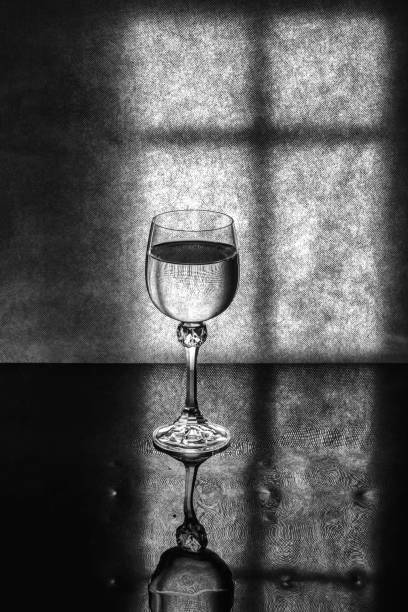 Still life with a glass on a window background