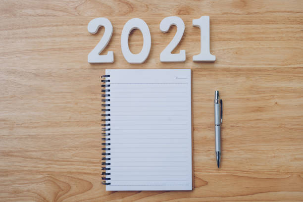 New year 2021 list. Office desk table with notebooks and pencil with copy space.