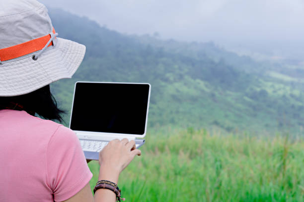 istock Backpacker relax with nature and use laptop for communication 1254932287
