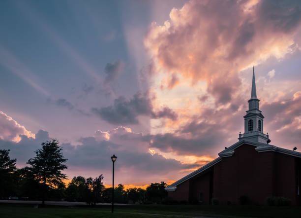 istock Sunset sky over Midwestern church 1254934073