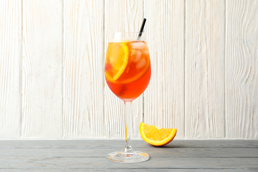 Spritz cocktail on wooden background. Summer drink