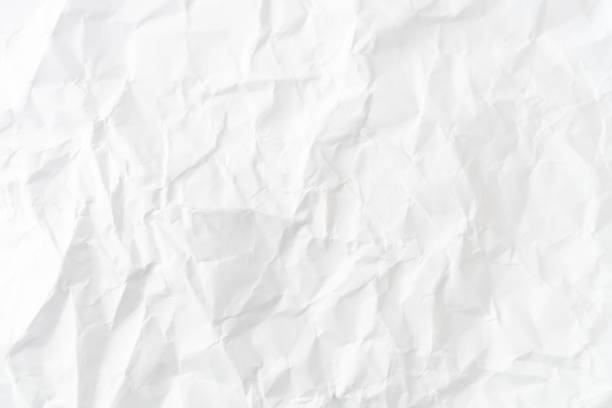 istock Top view of white crumpled paper texture background. 1254945091