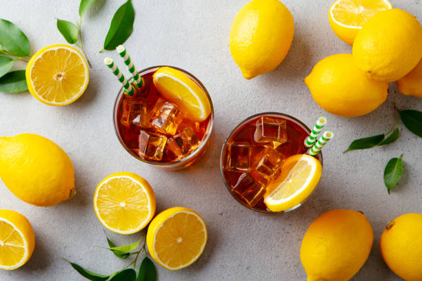 istock Ice tea with fresh lemons. Grey background. Close up. Top view. 1254946618
