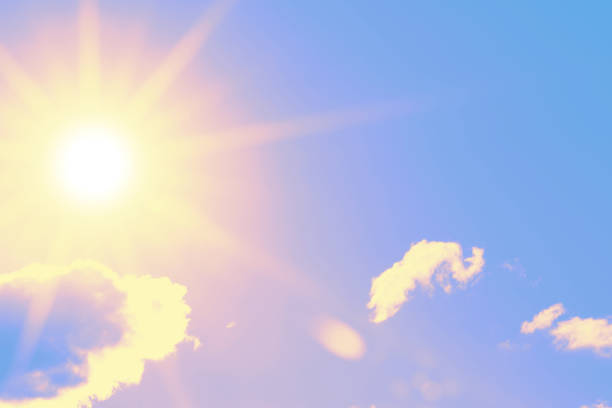 istock Bright sun with beautiful beams in the sky with clouds 1254947920