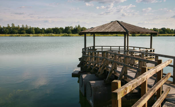 istock Observation pavilion over the lake in summer day. 1254948192