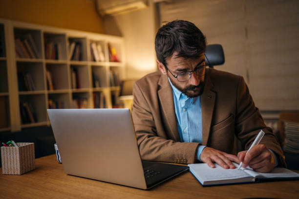 istock Man working late at home 1254949571