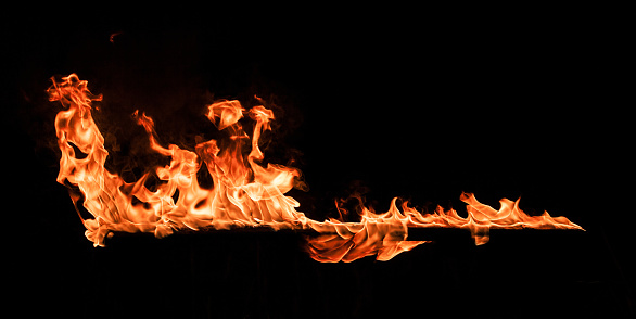 Burning fire isolated on black background