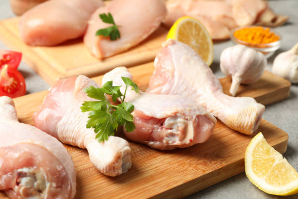 istock Composition with raw chicken meat on gray background, close up. Cooking chicken 1254951401