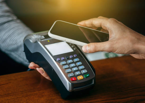istock Payment transaction with smartphone in cafe 1254952686