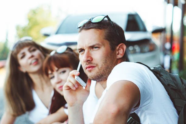 istock a guy is talking on the phone next to a girl 1254952871