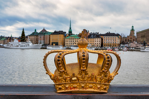 Crown on The Skeppsholm Bridge and Stockholm old town (Sweden)