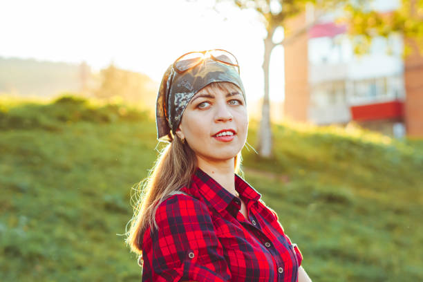 istock girl in a bandana at sunset 1254960205