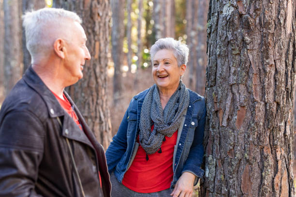 istock Happy Senior Couple Enjoying a Pine Tree Forest 1254962761