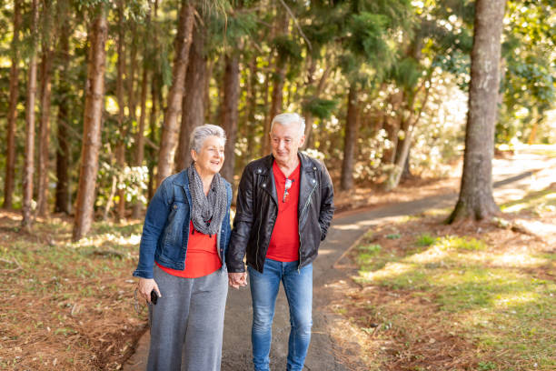 istock Happy Mature Couple Walking in a Forest 1254962772