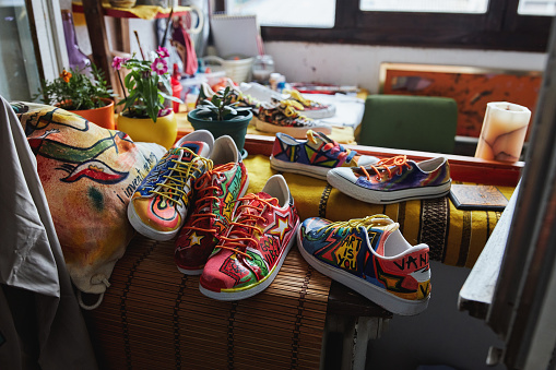 Ehibition of few pairs of sneakers and bag at the artist workshop