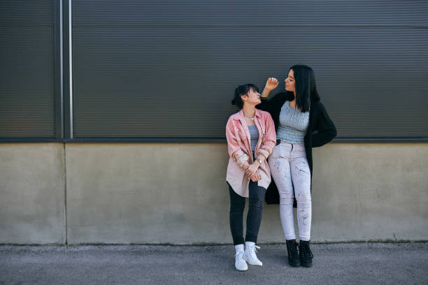 istock Modern beautiful girlfriends spending time together 1254964102