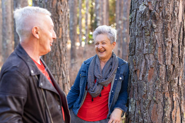 istock Happy Senior Couple Enjoying a Pine Tree Forest 1254964275