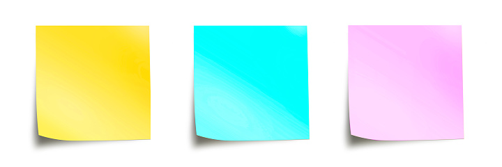 Three pastel colored sticky notes isolated on panoramic white background