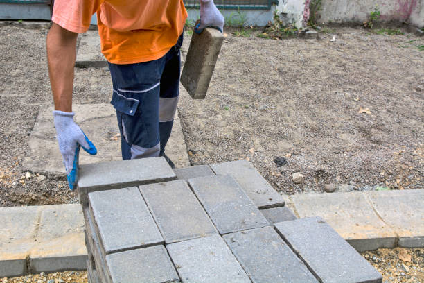 istock Laying concrete bricks for the sidewalk 1254970491