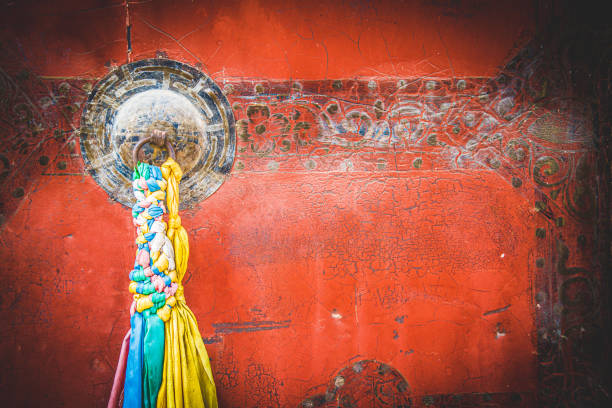 Traditional Colorful Tibetan Style Door Knob On The Red Wooden Door In Shangri La In Yunan In Shangri La In Yunan dalai lama stock pictures, royalty-free photos & images