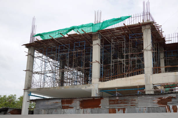 istock Scaffolding Steel Frame Installation in Construction Site.Safety First Concept. 1254973740
